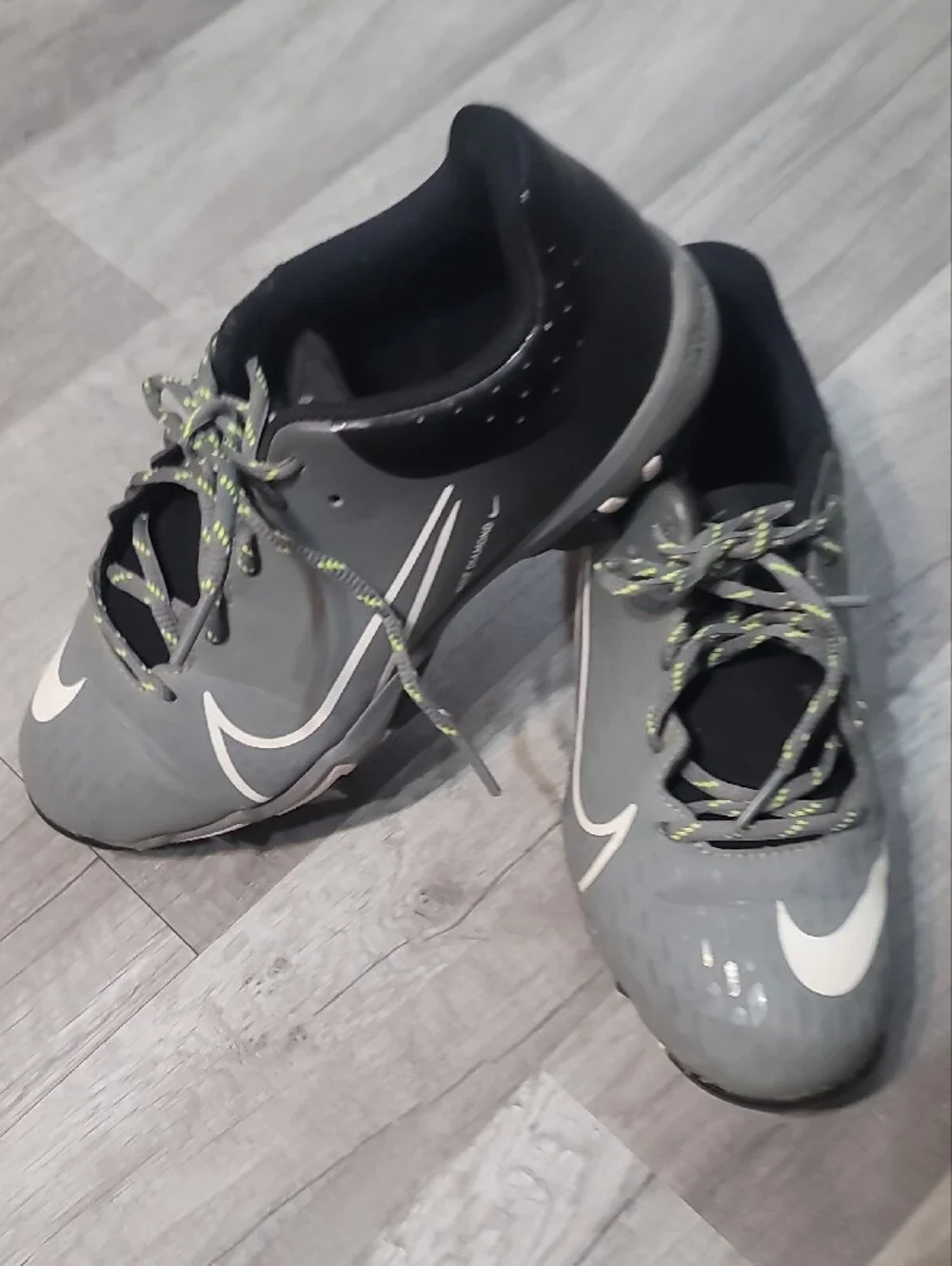 Nike Gray Cleetd with White Swoosh and Lime Laces 5Y